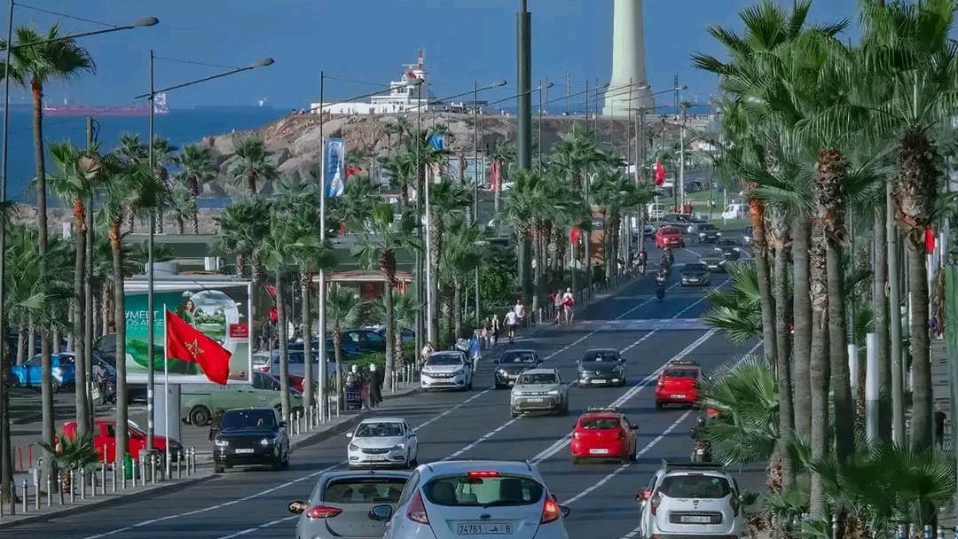 Palm-lined Corniche Ain Diab boulevard with El Hank lighthouse, Casablanca