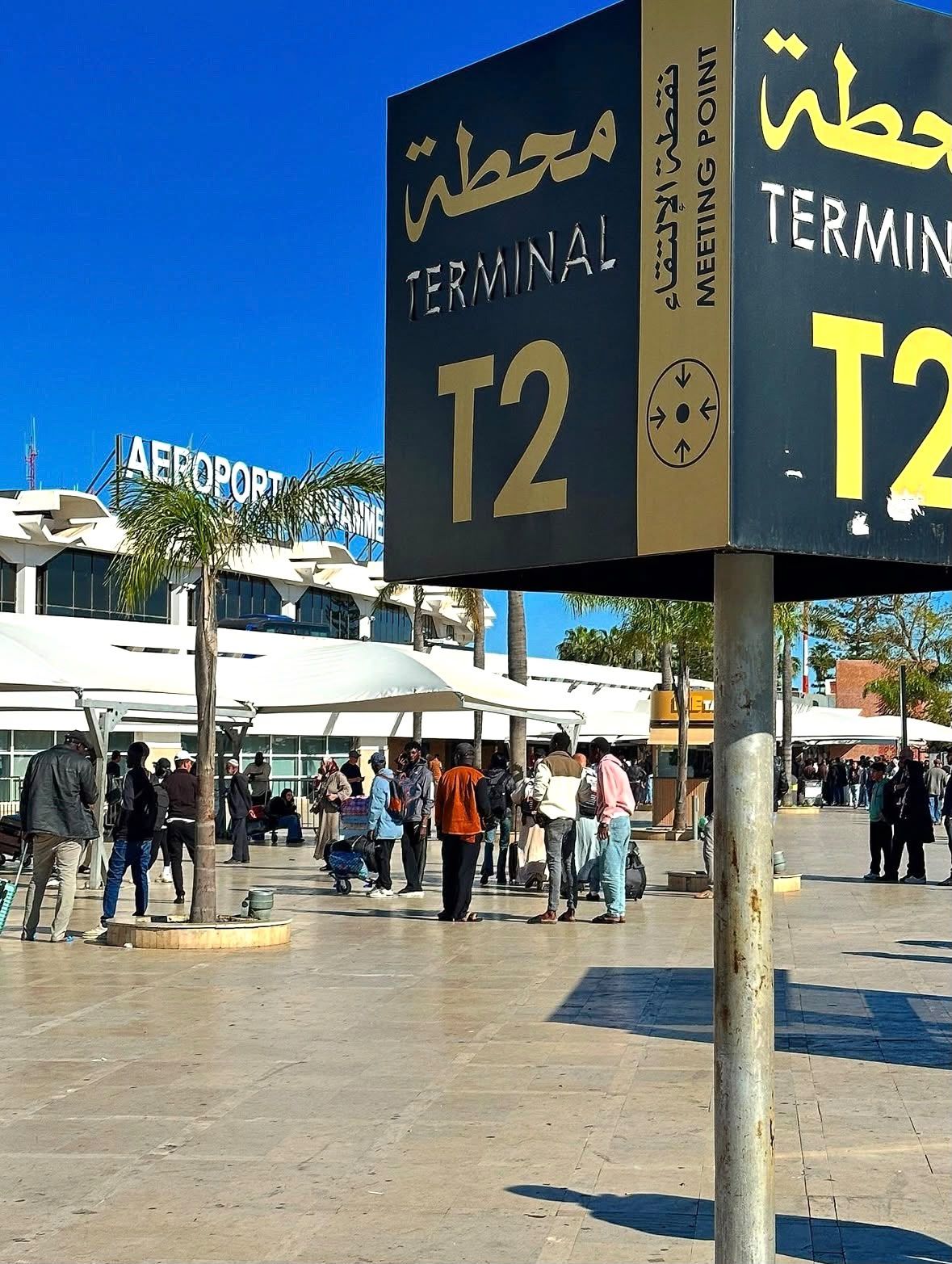 Terminal 2 meeting-point signage at Casablanca Mohammed V Airport