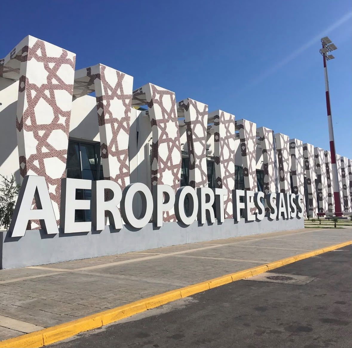 Aeroport Fes Saiss terminal facade with zellige-pattern columns and signage
